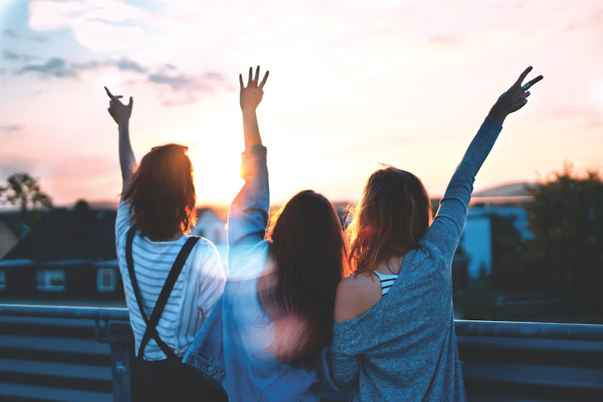 image of three friends staring at the sunlight