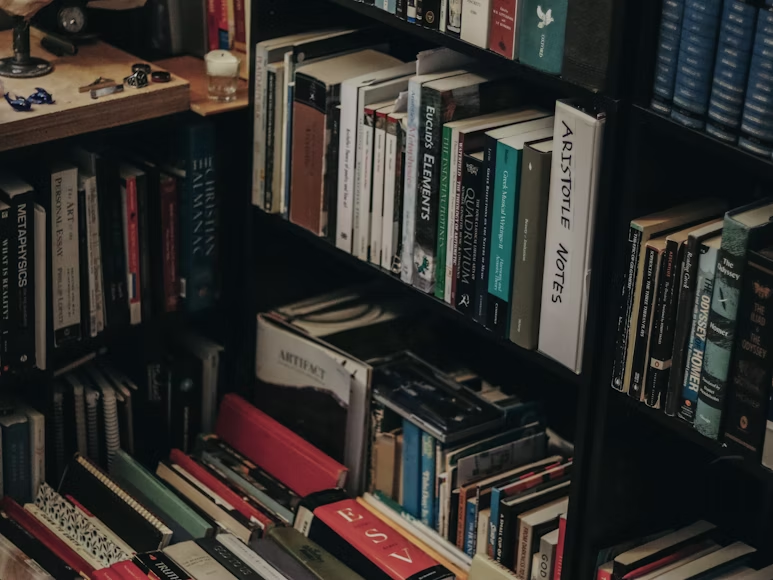 photograph of a crowded study full of books