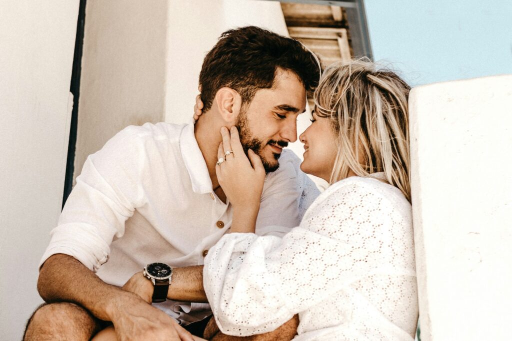 smiling man and woman about to kiss
