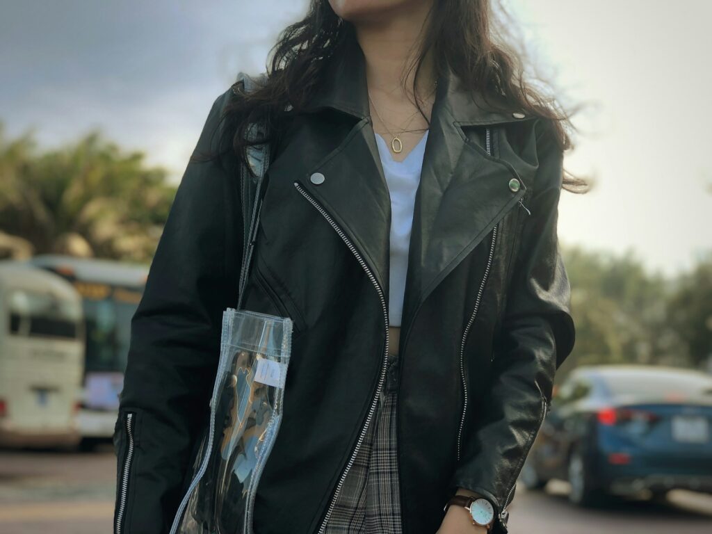 woman wearing black leather zip-up jacket
