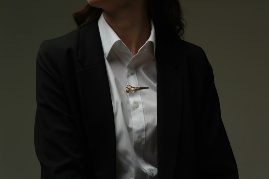 a woman wearing a white shirt and black jacket
