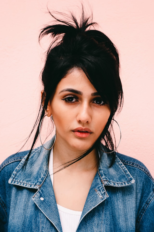 woman wearing blue denim jacket
