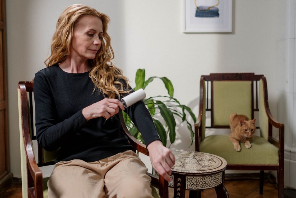 Woman Using Lint Remover

