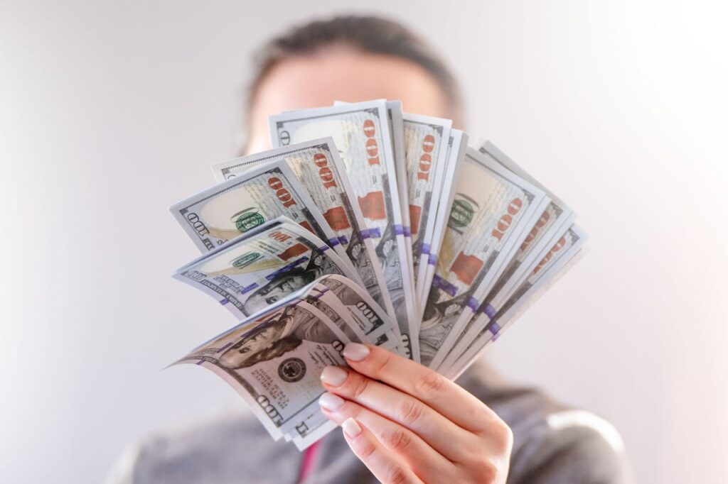 A Person Holding Paper Money