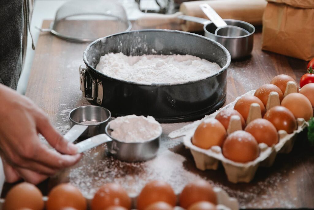 Chef preparing dough with flour and eggs
