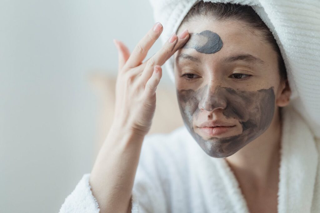 Close-up View of Woman Applying Beauty Mask