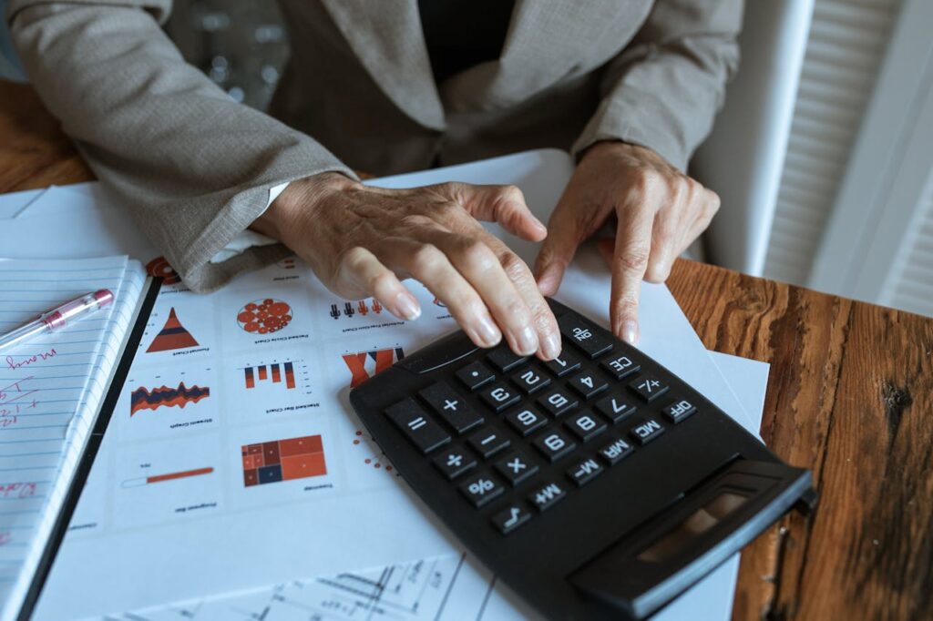 Person Computing Using A Black Calculator