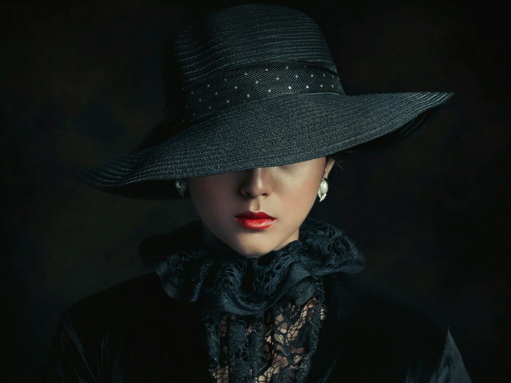 a woman wearing a black hat and scarf
