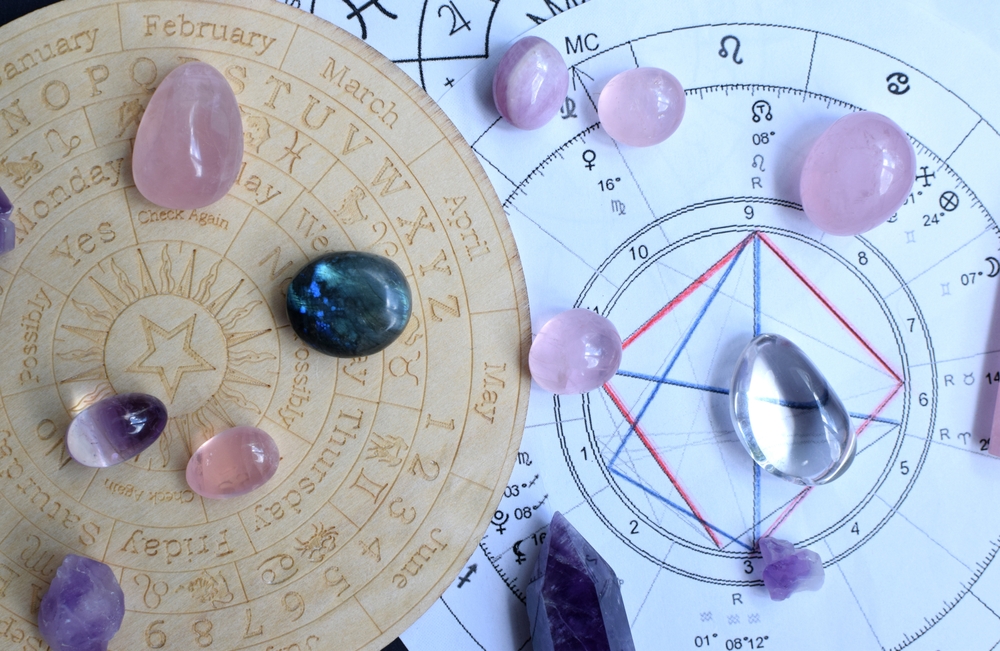 Beautiful amethyst crystals and dry herbs with symbols of the zodiac signs. Predictions, witchcraft, spiritual esoteric practice.