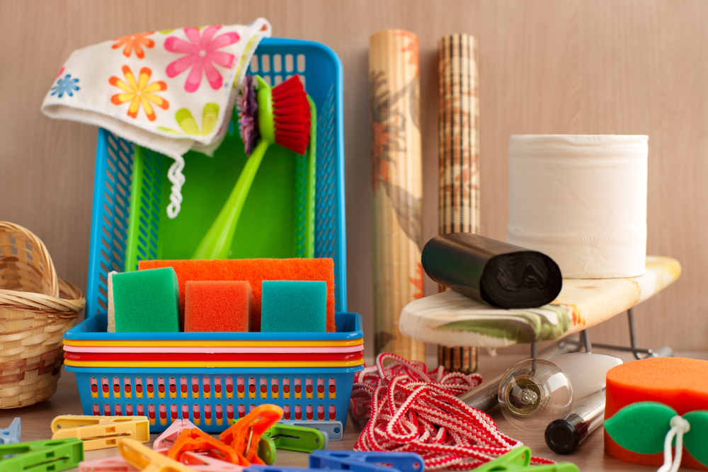 Many household goods. Ironing board, plastic boxes, toilet paper, garbage bags, parallon sponges, clothespins are household utensils. Household items for everyday life.