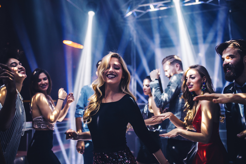 Shot of a young woman dancing in the nightclub
