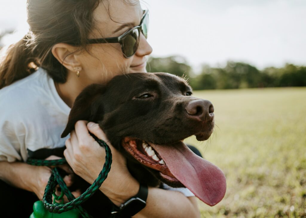 woman hugging a dog
