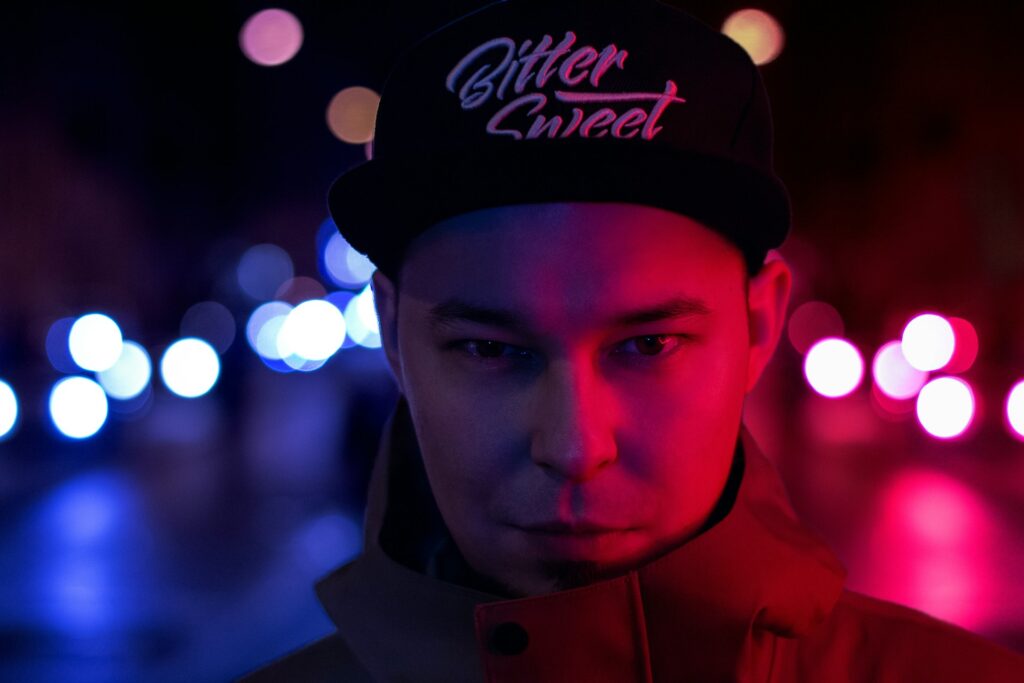 a man wearing a hat with the word bitter sweet on it
