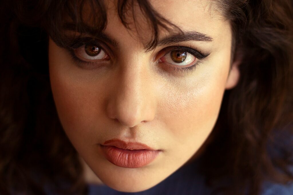 a close up of a woman with dark hair