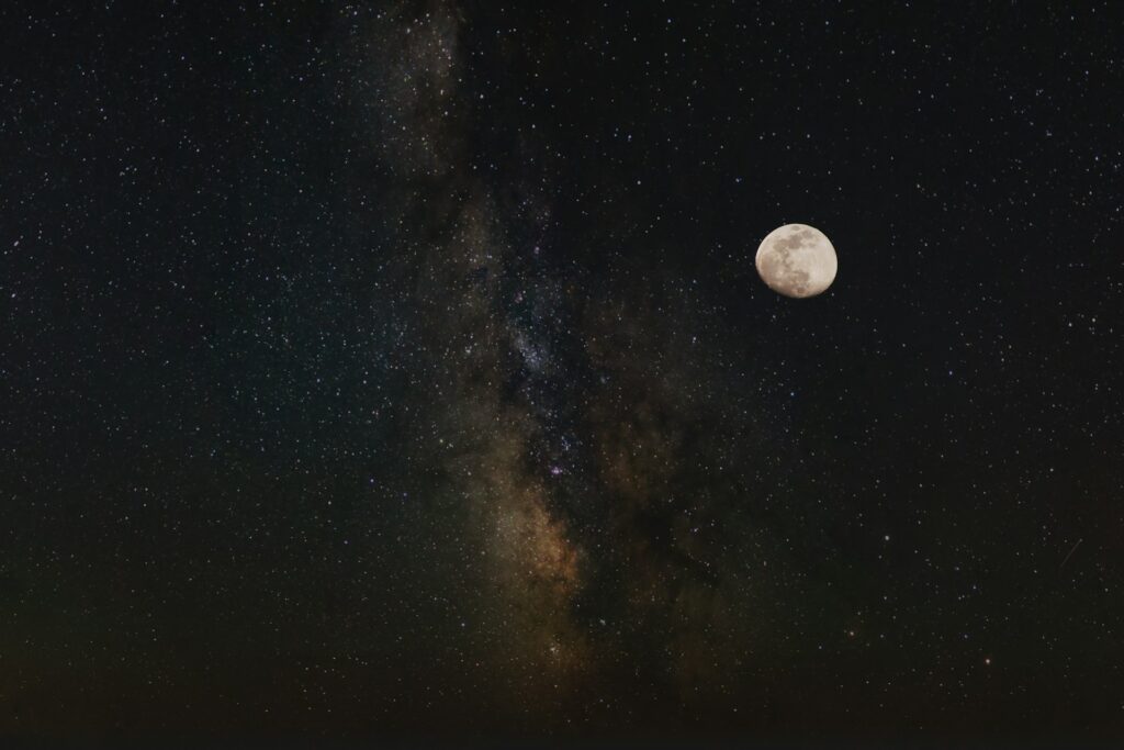 the night sky with the stars and the moon