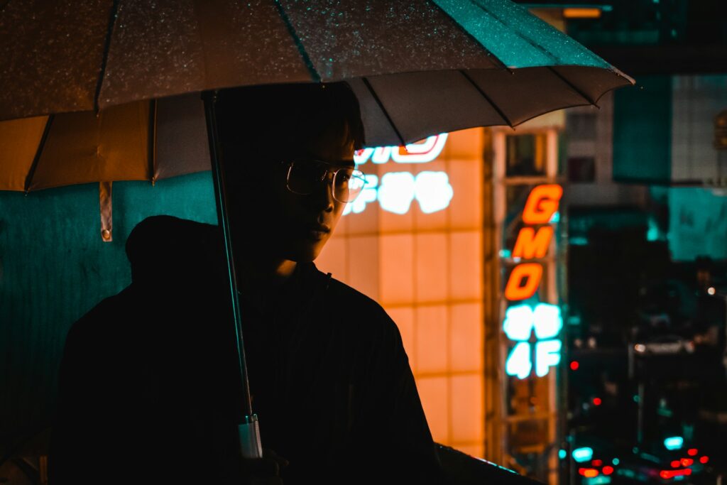 a person holding an umbrella
