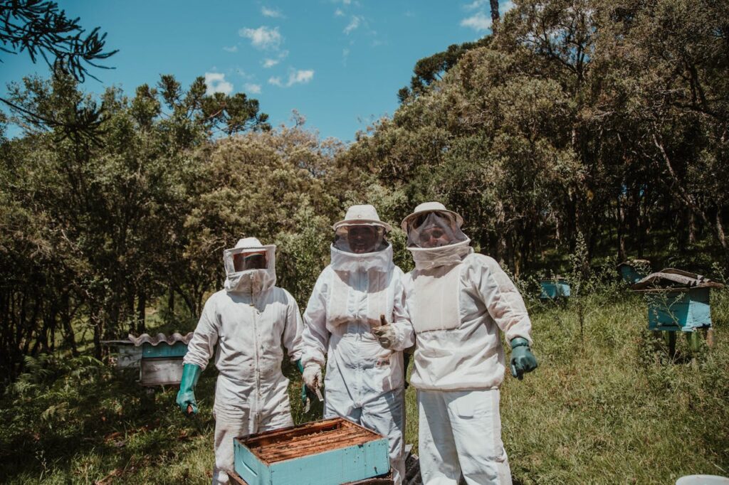 Three People in White Suit
