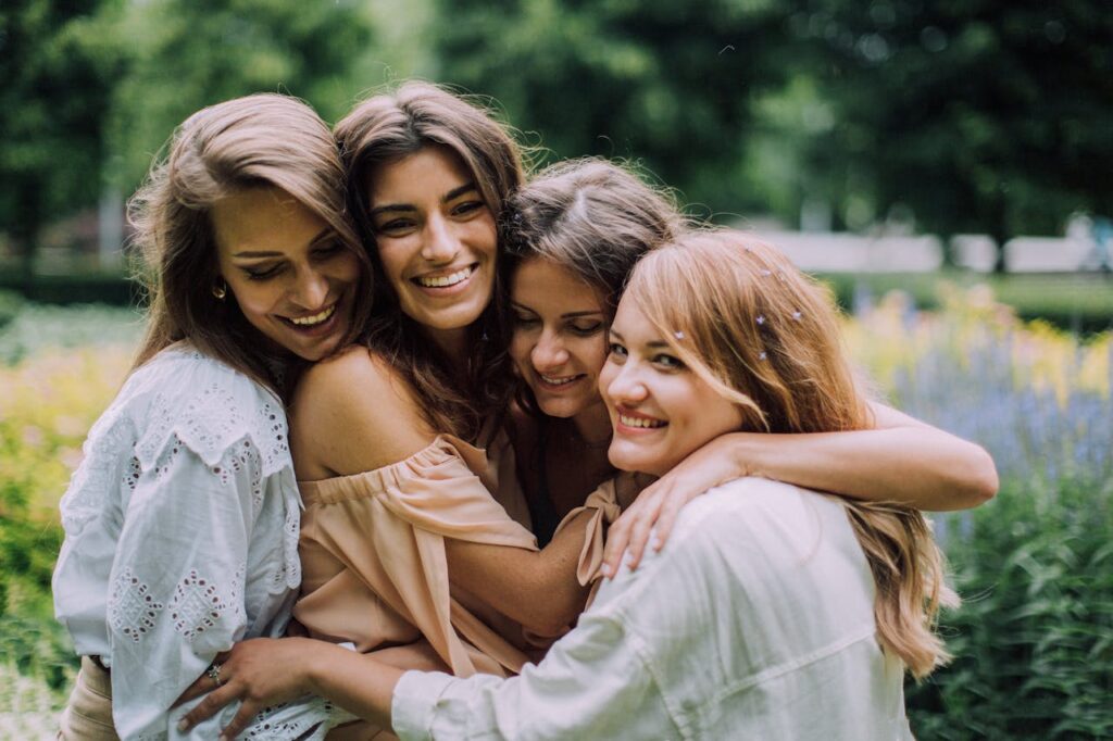 Women Hugging and Smiling
