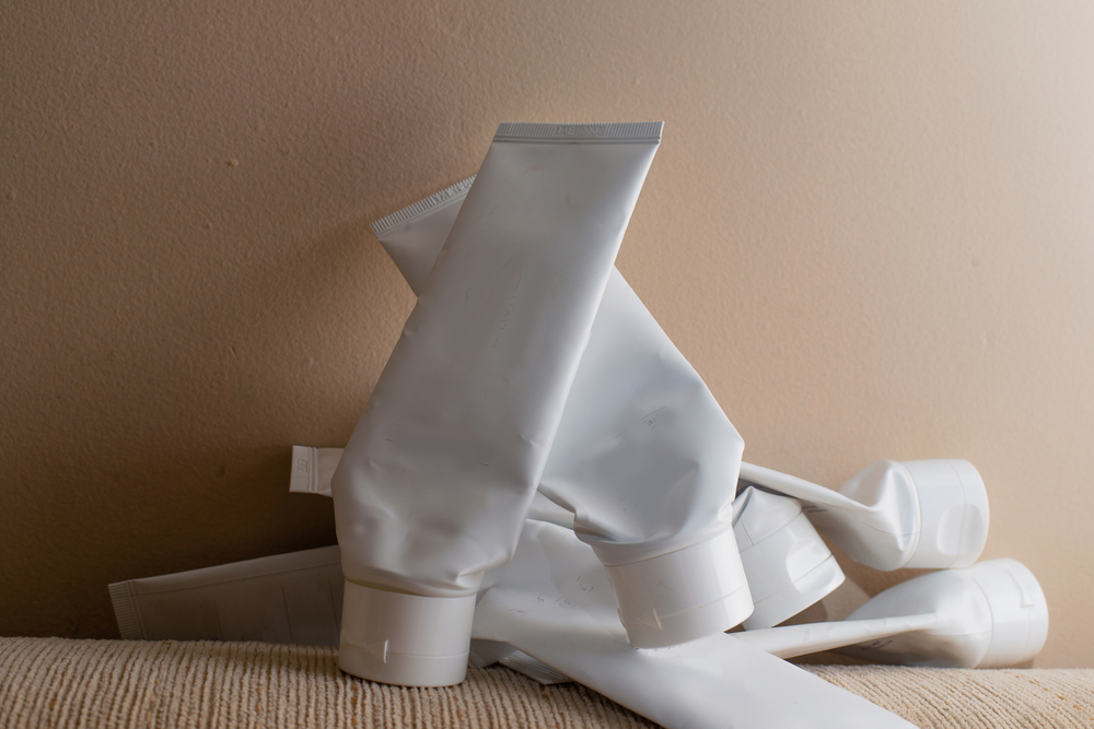 pile of skin care tube used up