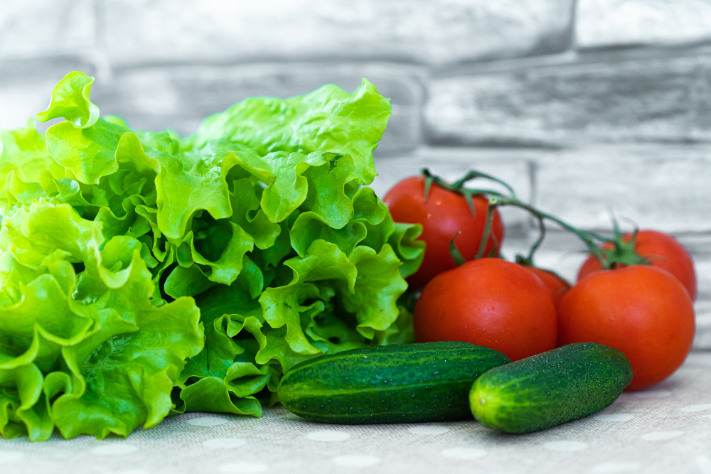 vegetables on the table tomatoes, cucumbers and lettuce, food delivery