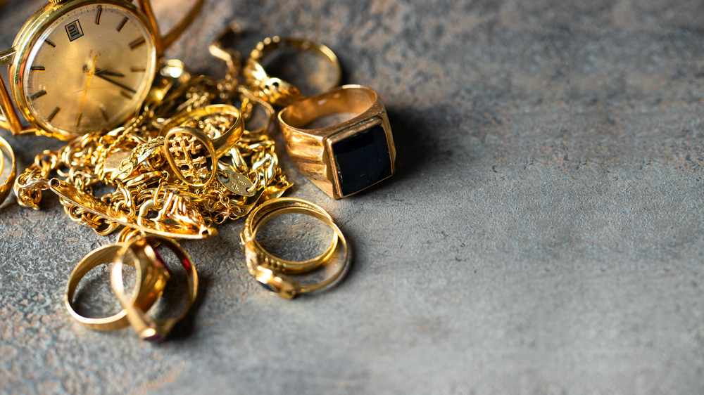 Old and broken jewelry, vintage watches on dark background. Sell  gold  for cash concept. 