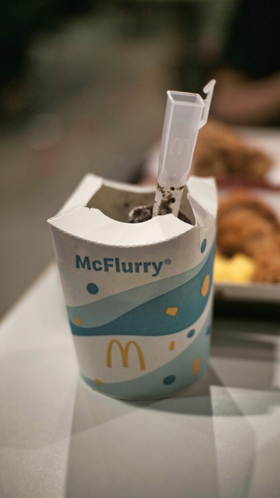 white and blue paper bag
