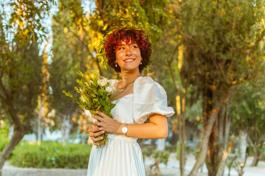 a person holding flowers
