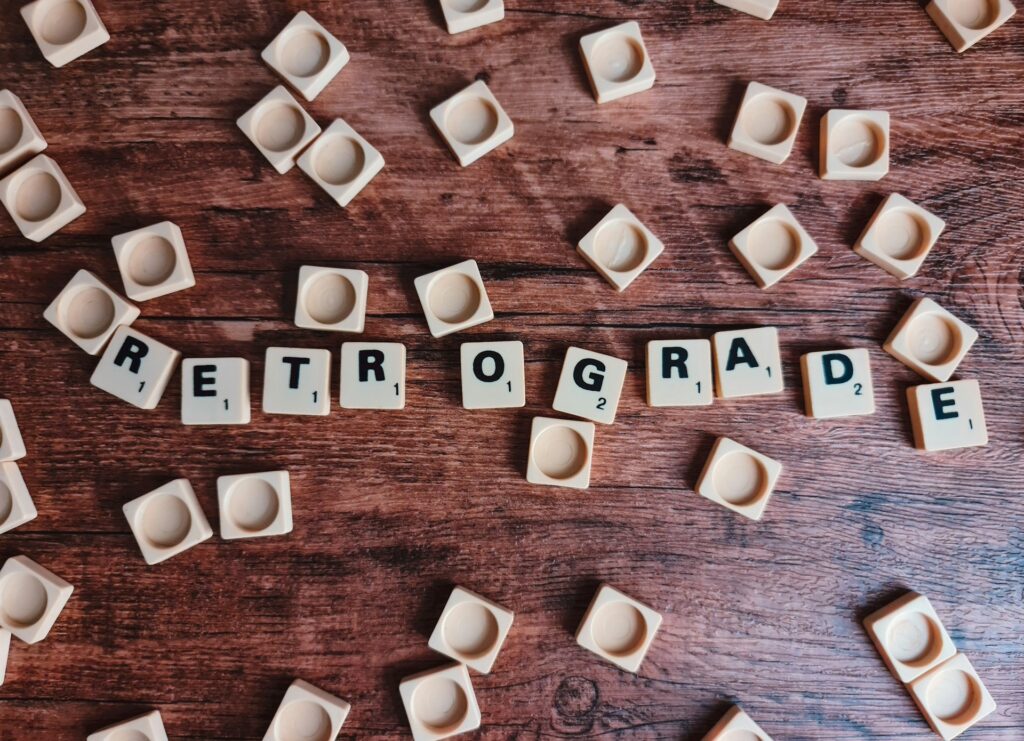brown wooden letter blocks on brown wooden table