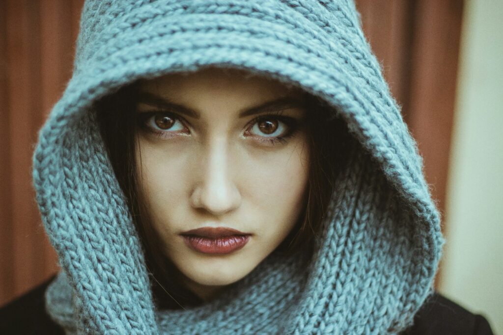 a woman wearing a blue scarf around her head