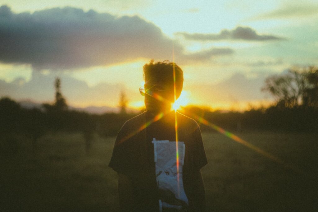 Man in Eyeglasses Back Lit by the Sunlight
