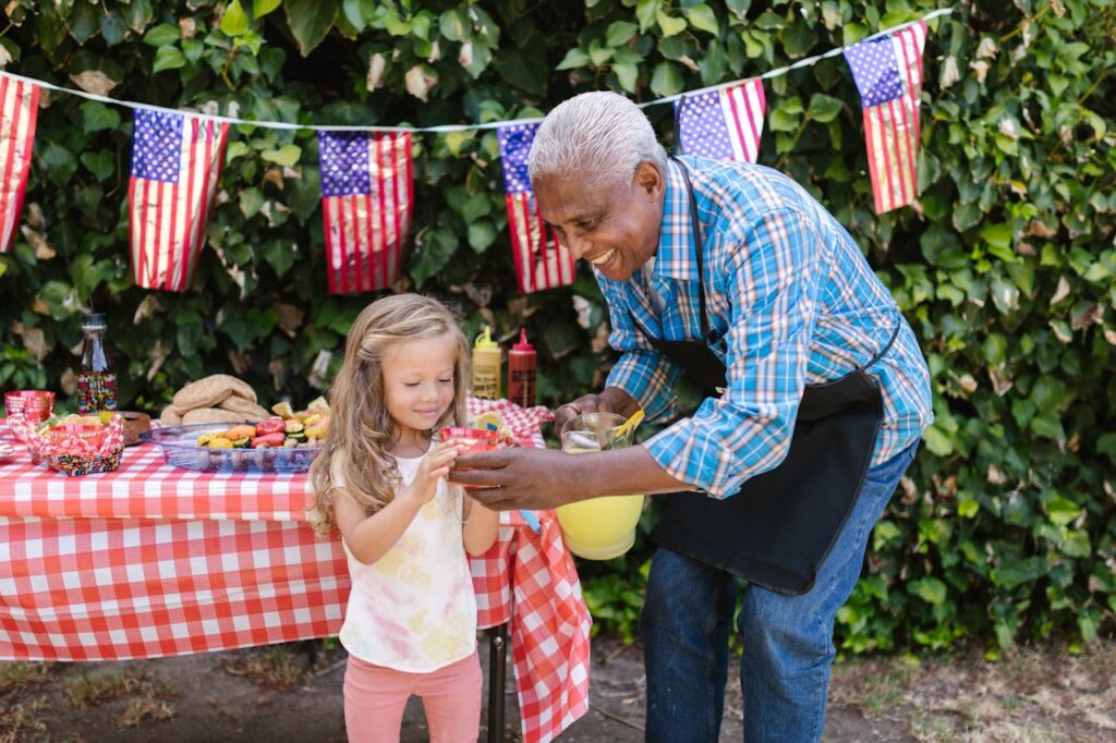 Man Giving Juice of a Young Girl