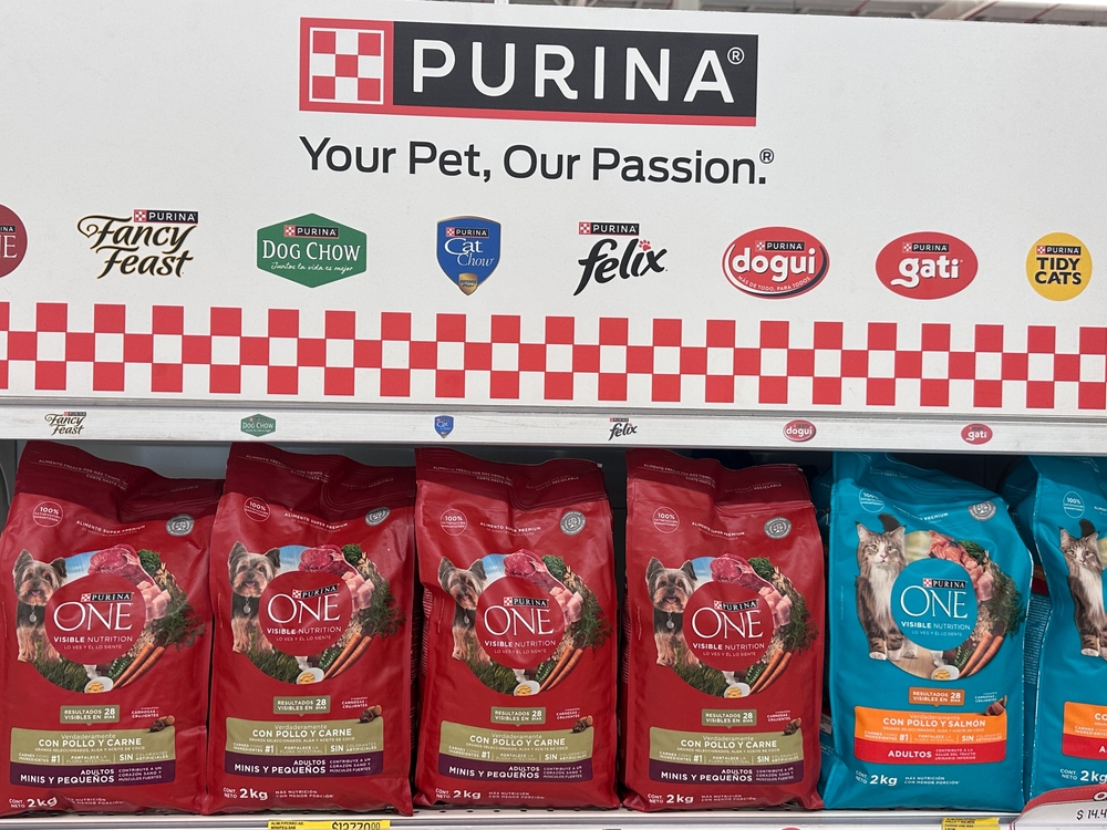 Buenos Aires, Argentina - april, 20, 2025: Various Purina pet food bags displayed on a supermarket shelf. Visible products include Purina ONE, Dog Chow, Cat Chow, Felix, Dogui, Gati.
