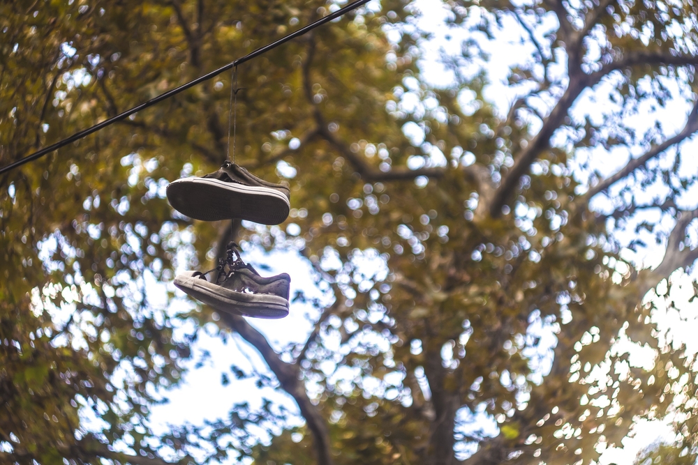 Autumn in Buenos Aires Shoes Hanging on a Wire Cable