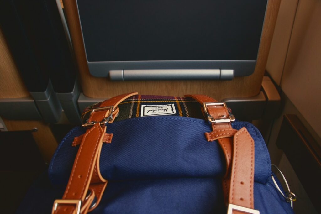 a blue bag sitting on top of a wooden table
