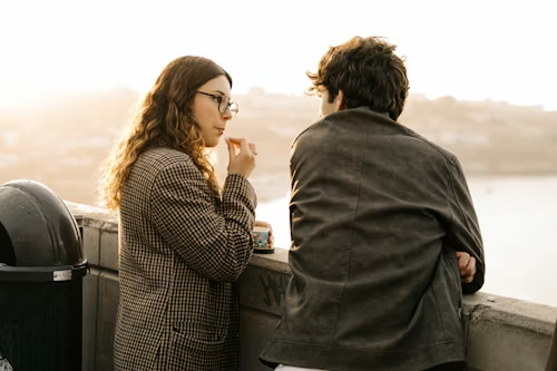 a-man-and-a-woman-standing-next-to-each-other