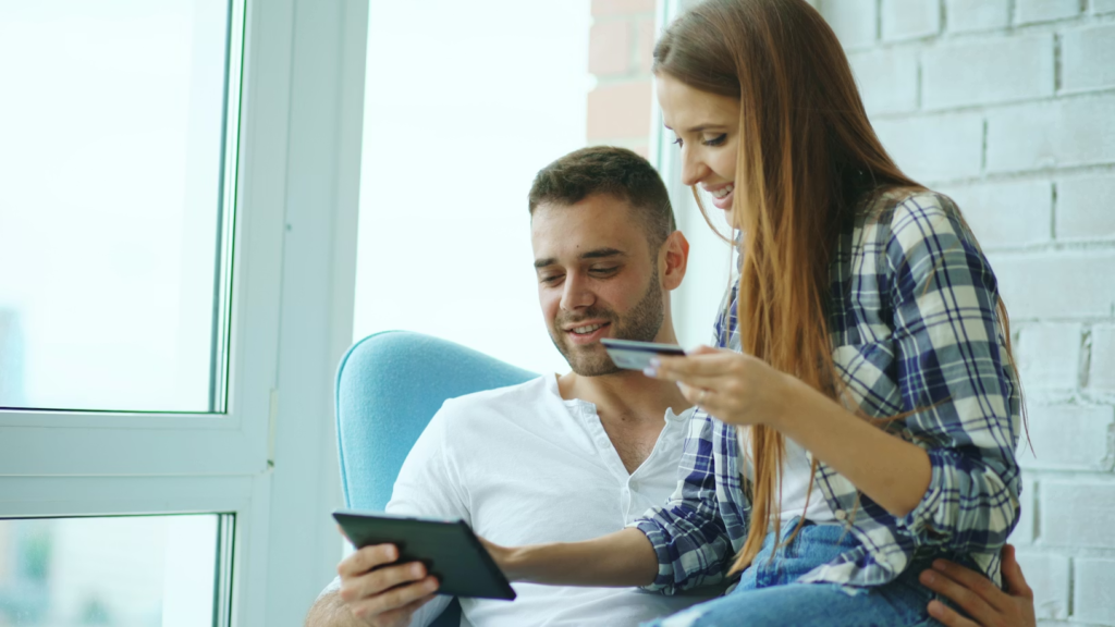 couple-happily-shopping-online-with-tablet-and-credit-card