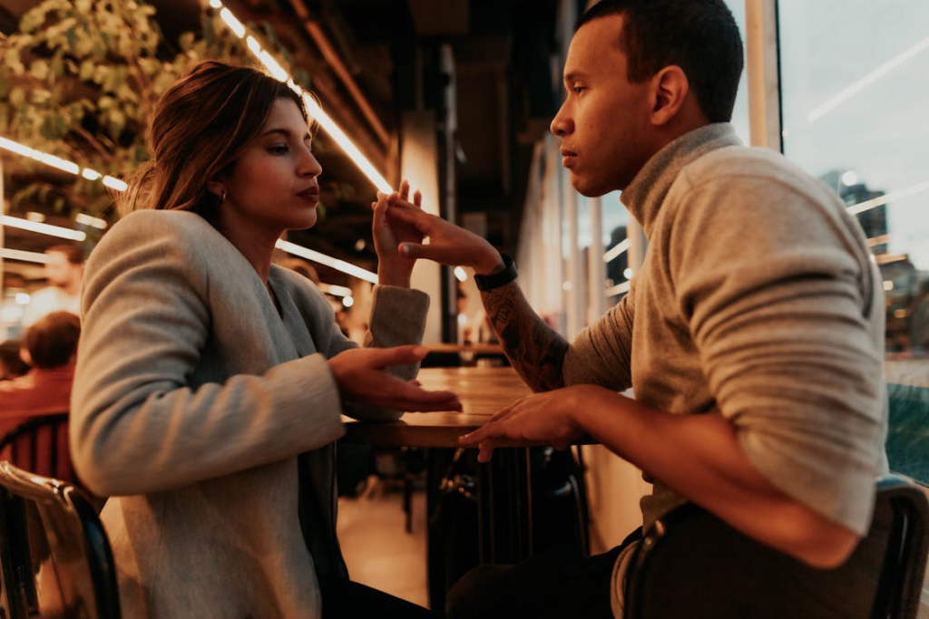 Romantic Couple Engaged in Conversation at Café