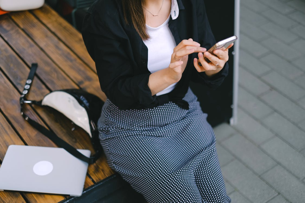 Young Woman Using Smartphone Outdoors