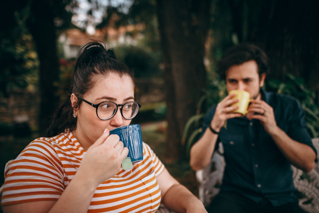 Couple Enjoying Tea in a Garden Setting