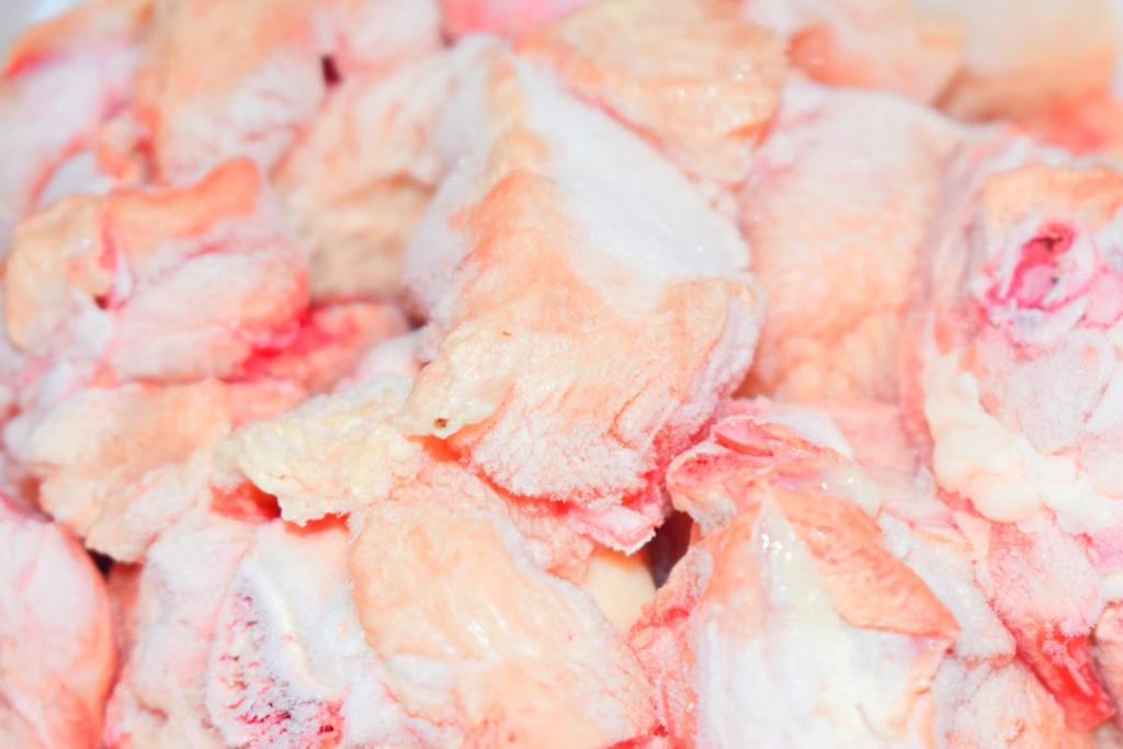 photo of bulk chicken in a freezer.
