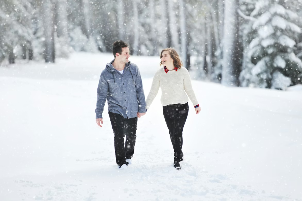 Couple walking in the snow.