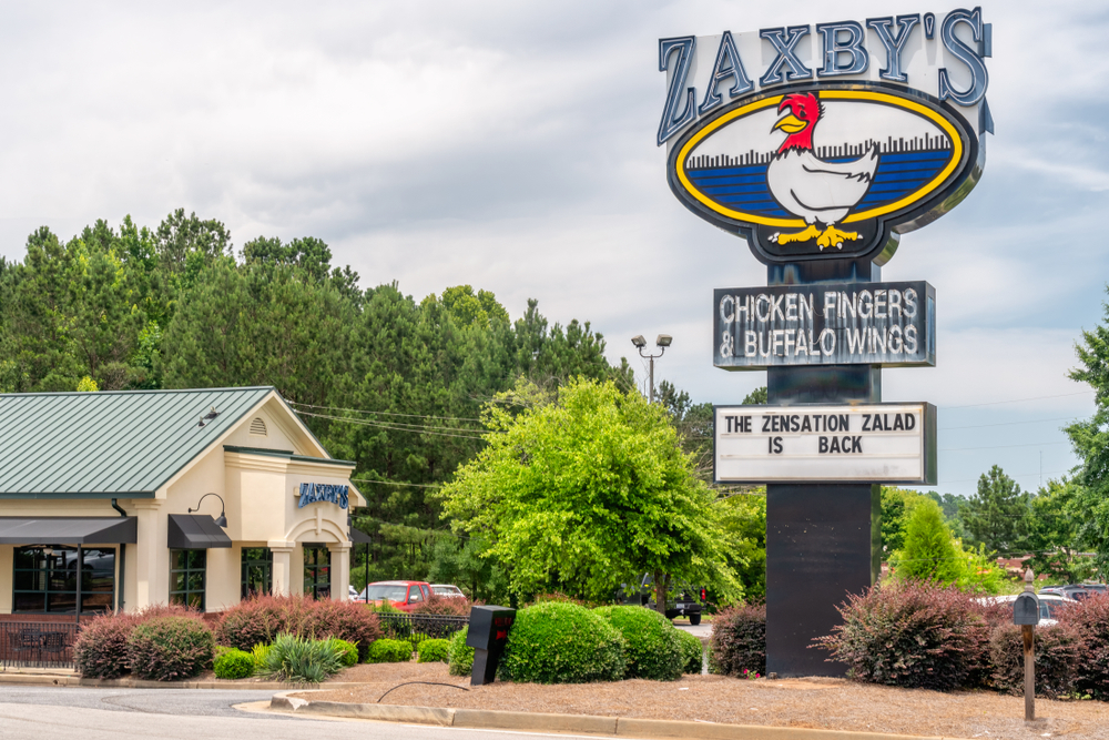 ATHENS, GA/USA -JUNE 5, 2018. Zaxby's restaurant exterior and trademark logo. Zaxby's is a chain of fast food restaurants.