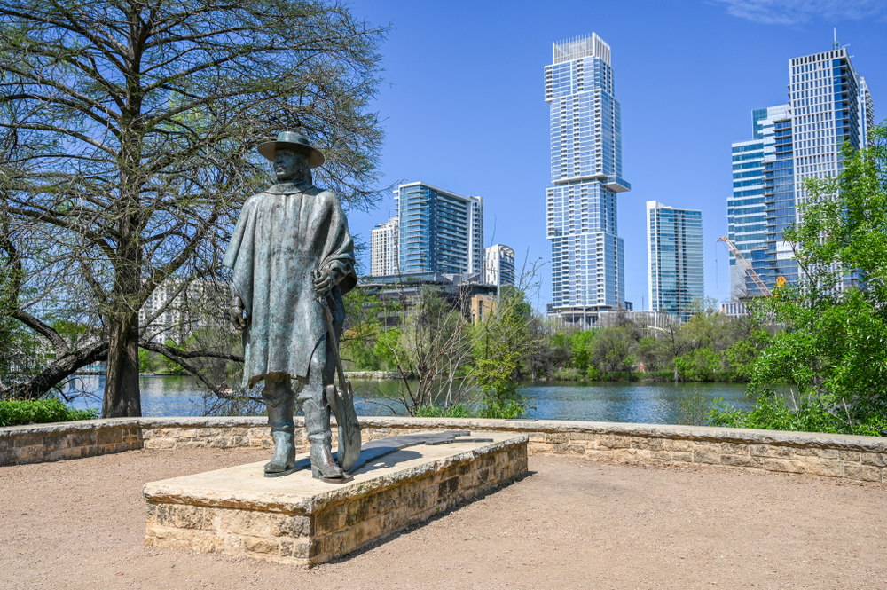 AUSTIN, TEXAS, USA - March 17, 2019: Sculpture of Stevie Ray Vaughan at Auditorium Shores in Town Lake Metropolitan Park.  He was a Texas blues guitar legend.
