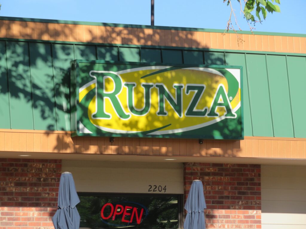 Open Runza Restaurant - Sign above the entry door facing the main road (Loveland, Colorado, USA) - 06\20\2022