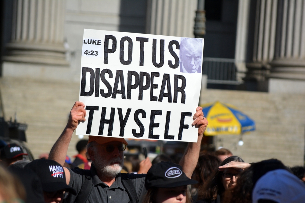 NEW YORK, NEW YORK USA - May 1, 2025: Anti-Trump sign at a May Day rally in support of workers' rights in Lower Manhattan.