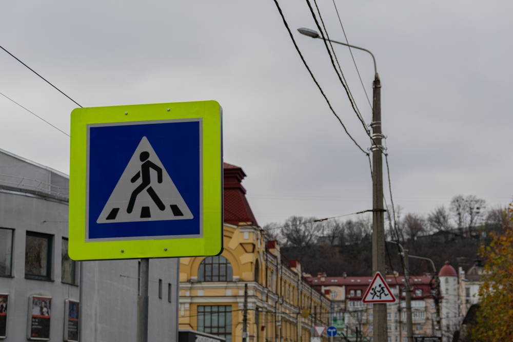pedestrian crossing sign on the street