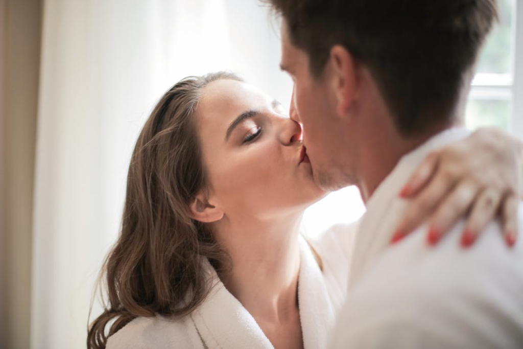 woman kissing man
