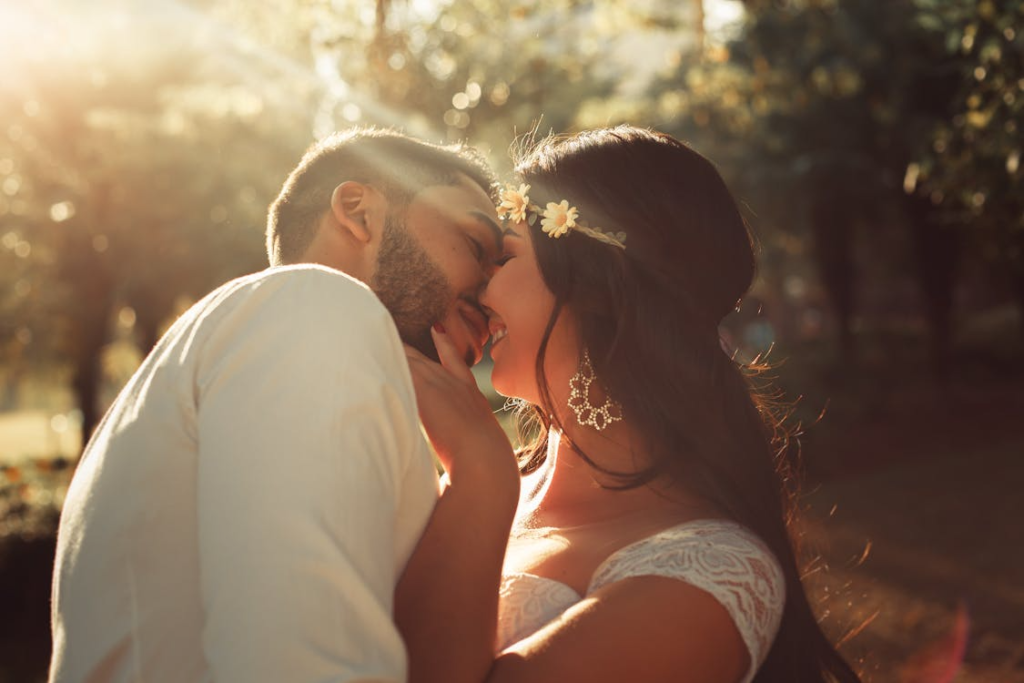 Woman and man kissing outside