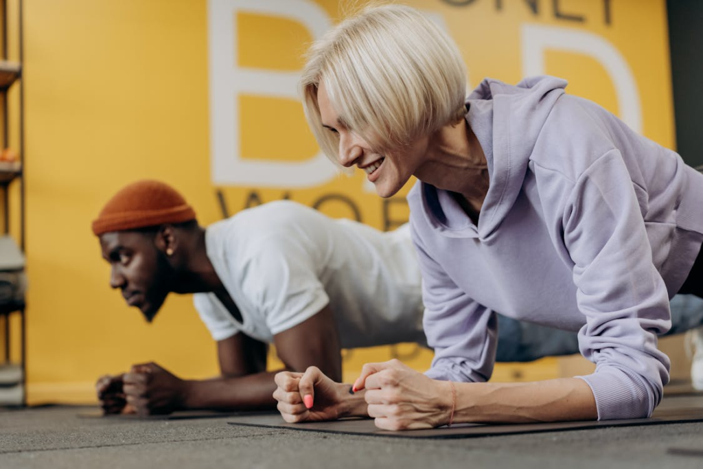 Man And Woman Doing Planks