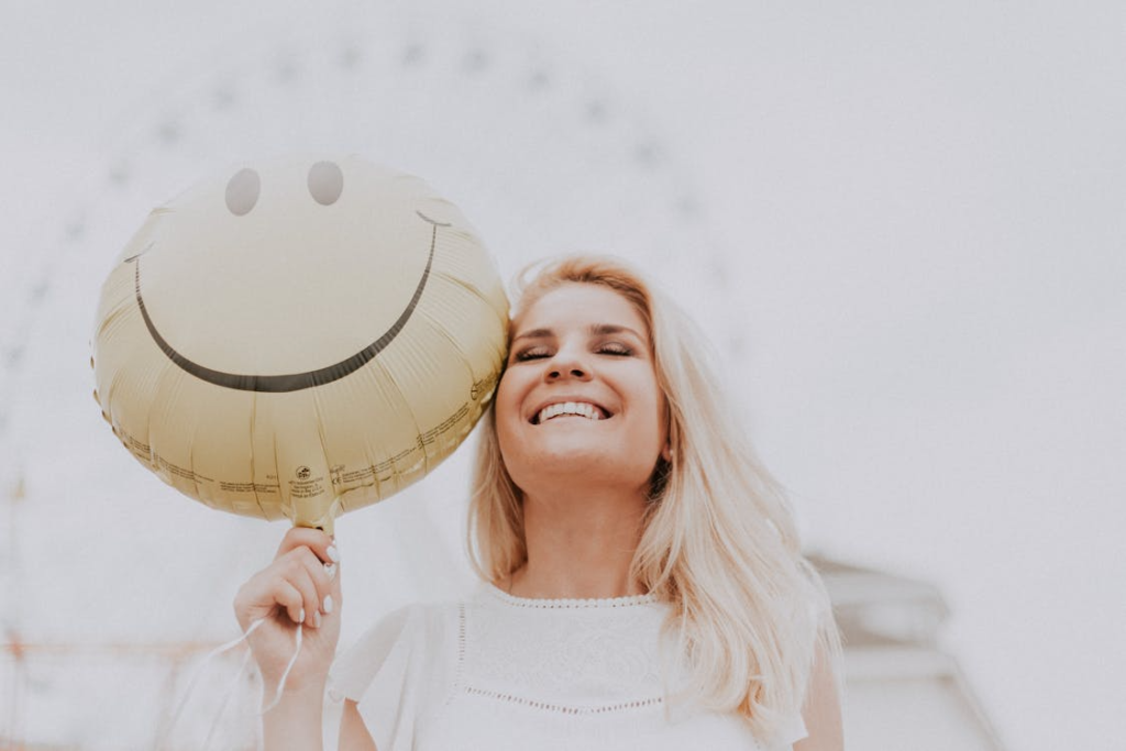 woman holding balloon